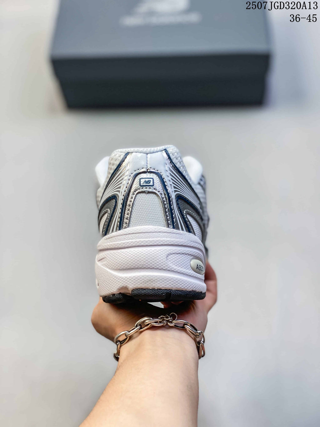 Rear view showing the padded heel, layered upper detailing, and white midsole.