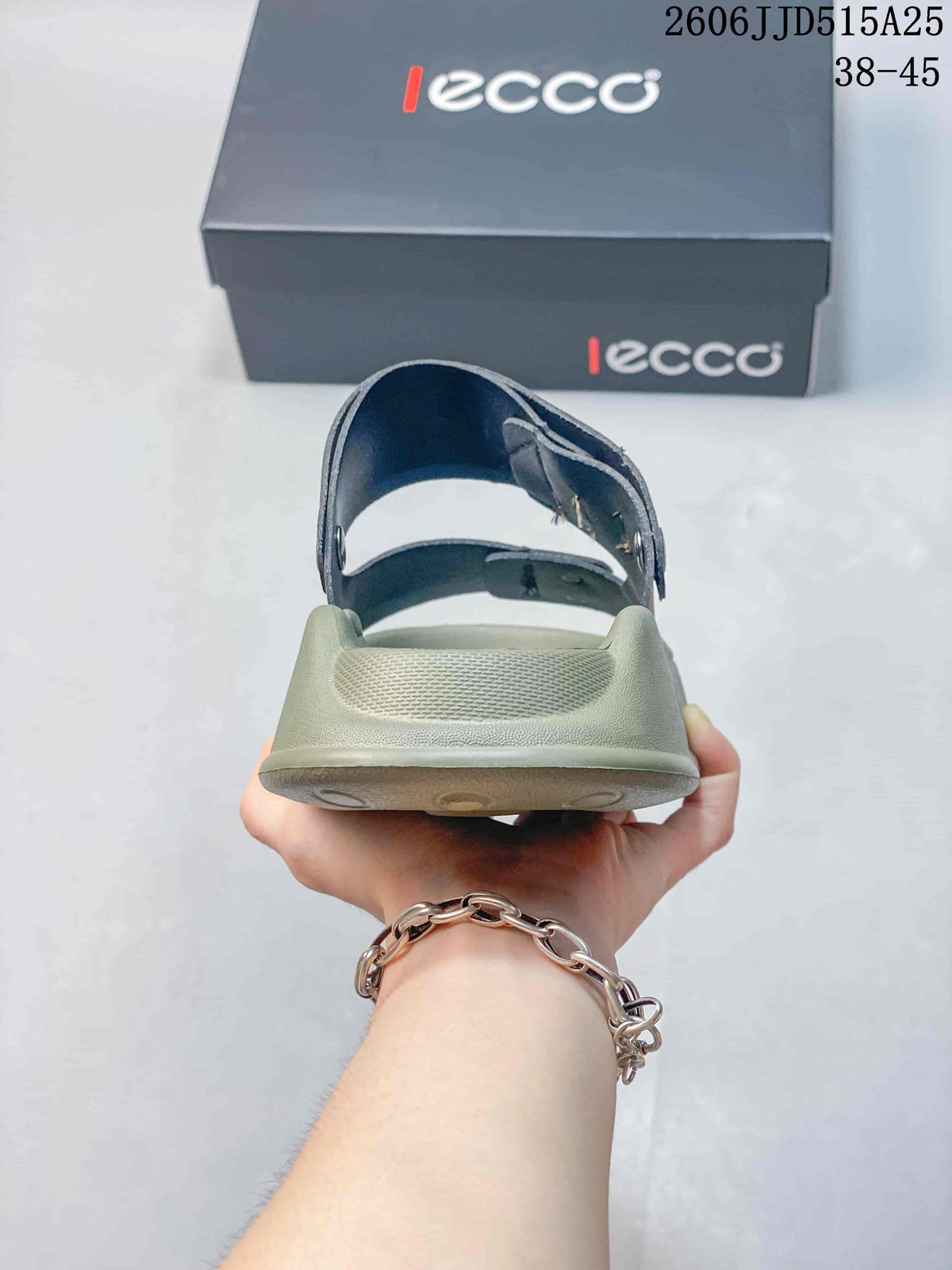 Rear view of the sandal showing the open heel area, textured footbed, and adjustable rear strap.