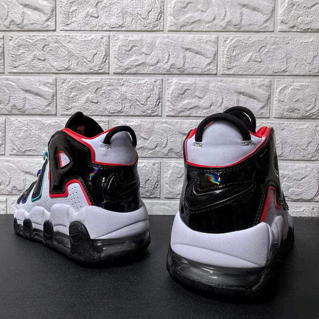 Rear view showing the black heel panels, white collars, and visible heel air units