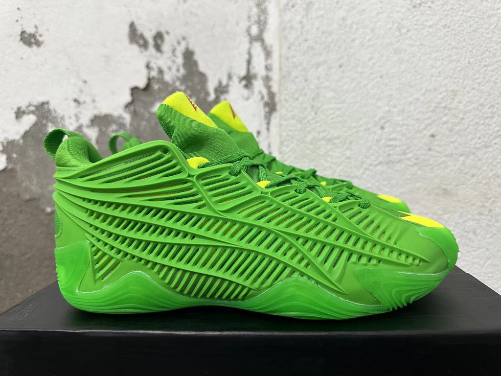 Side profile showing the openwork cage design on green Adidas sneakers