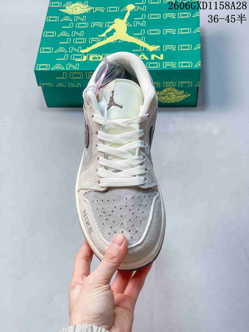 Front view showing the perforated toe, white laces and tongue logo