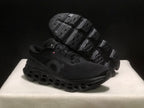 Black Cloudmonster 3 sneaker shown from the side with the outsole tread visible on the raised shoe.