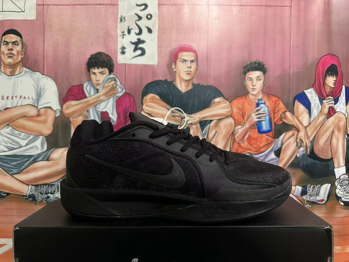Side profile of a black Nike basketball shoe showing the Swoosh and Kobe signature detail