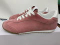 Side view of pink Alo low-top sneakers with white laces, white heel detail and gum-colored outsole.