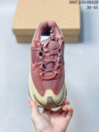 Top view showing the burgundy mesh-like upper, layered overlays, laces, and toggle-style detail.