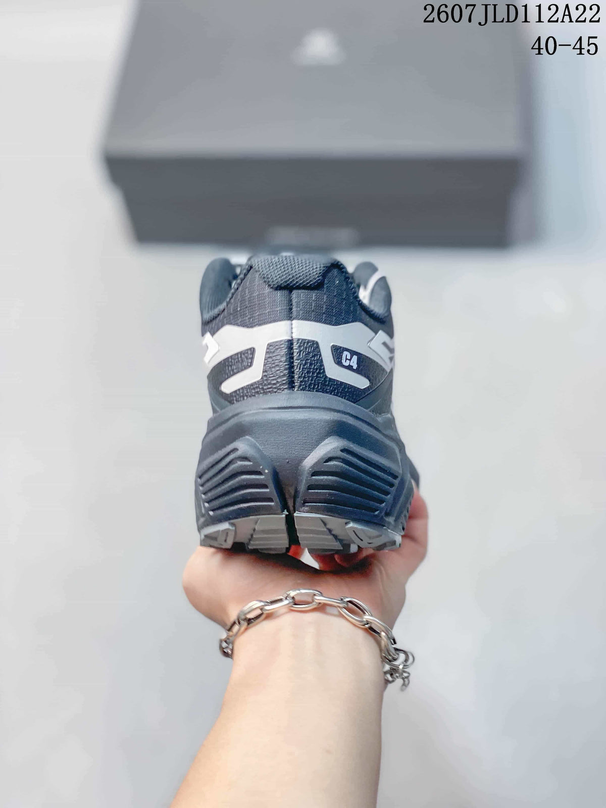 Rear view showing the padded heel, layered outsole, and C4 marking.