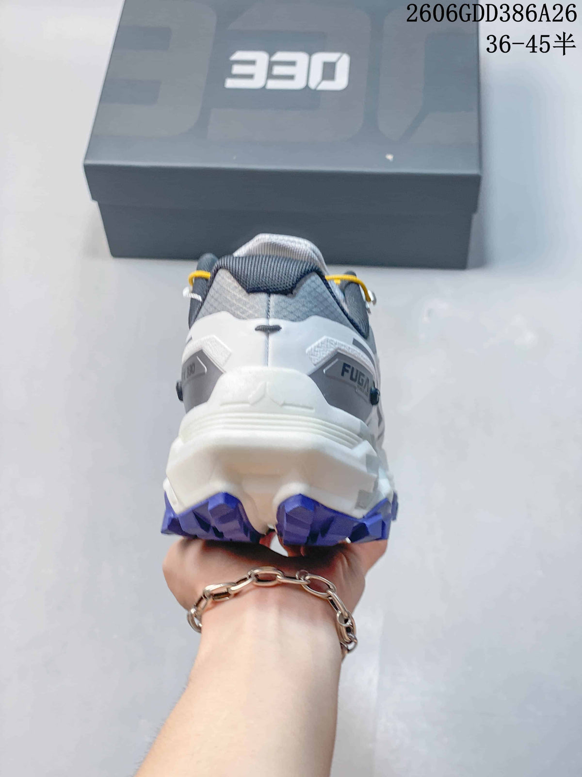 Rear view of a Kailas FUGA EX330 trail shoe showing its heel and purple outsole