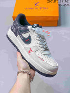 Angled view of the sneaker showing its side panel, patterned heel, and dark outsole