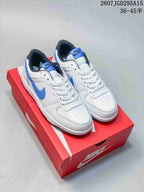 Pair of white and blue Nike SB Dunk Low Pro sneakers displayed on a red Nike shoebox; the image shows style code 2607TGD295A15 and size range 36–45.