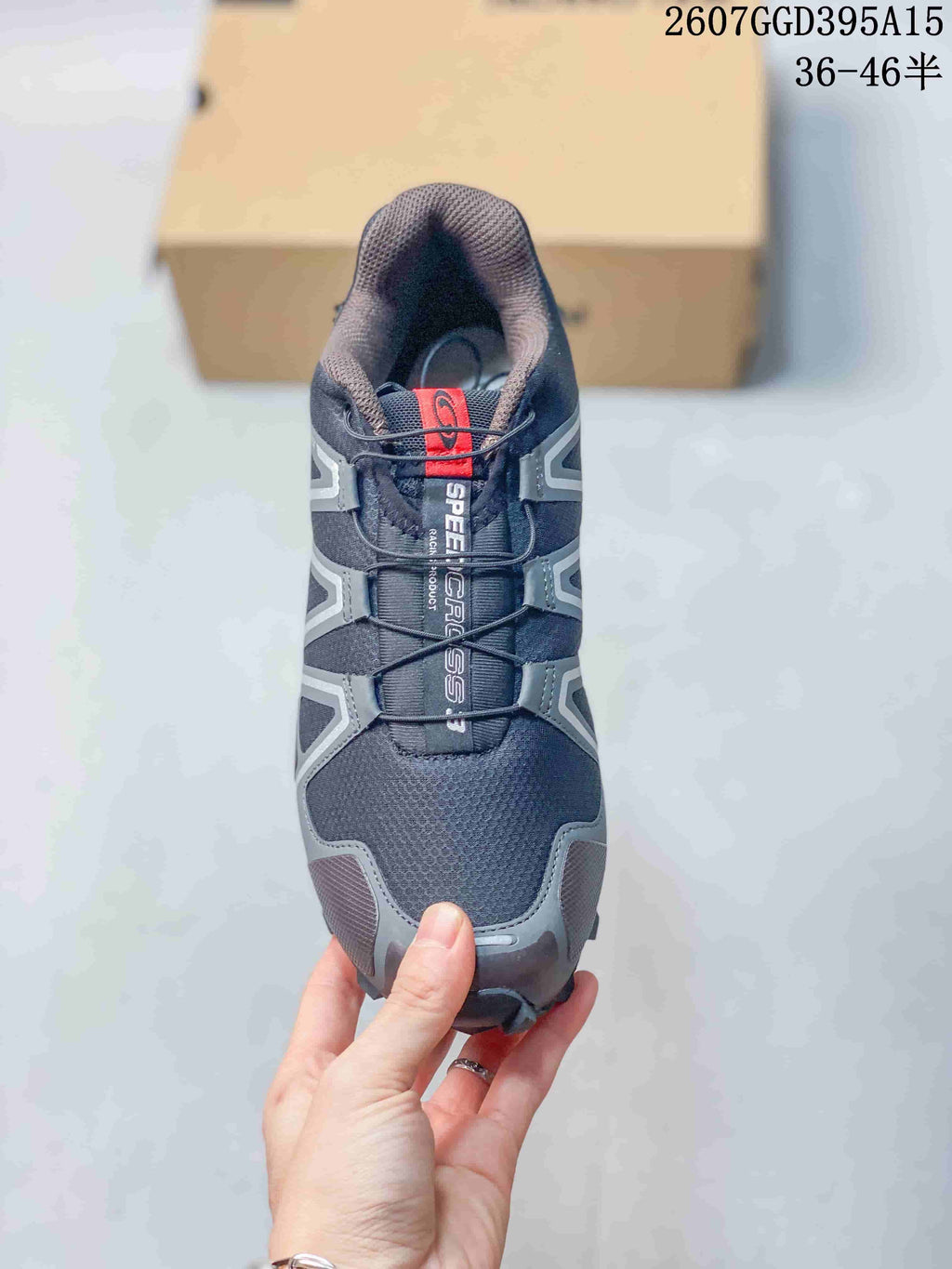 Top view of a Salomon Speedcross 3 shoe showing the dark upper, gray overlays, padded collar, and quick-lace style fastening.