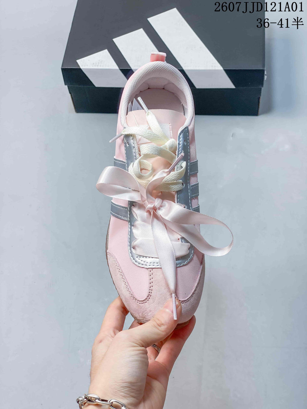 Top view of the sneaker showing ribbon-style and standard laces