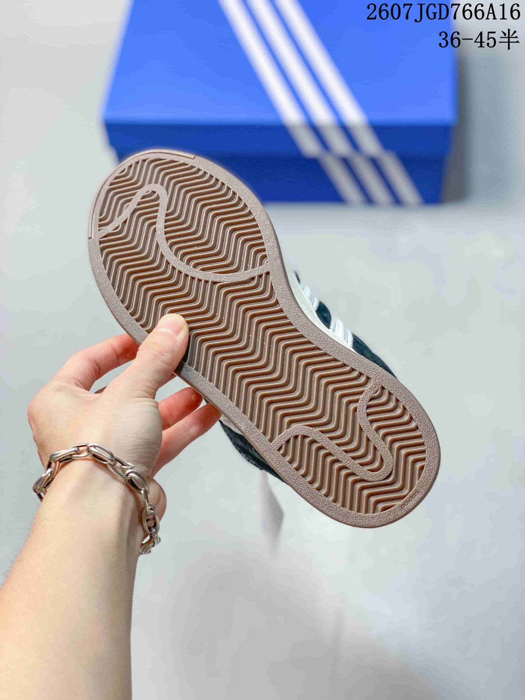 Close-up of the textured rubber outsole with a zigzag tread pattern.