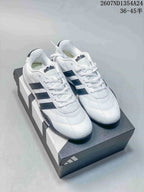 Pair of white and black adidas Adipista low-top sneakers displayed on a shoebox; image text shows style code 2607ND1354A24 and size range 36–45.5.