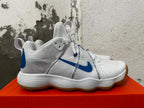 Side view of a white Nike Hyperdunk shoe with blue Swoosh, midfoot strap, and gum-colored outsole.