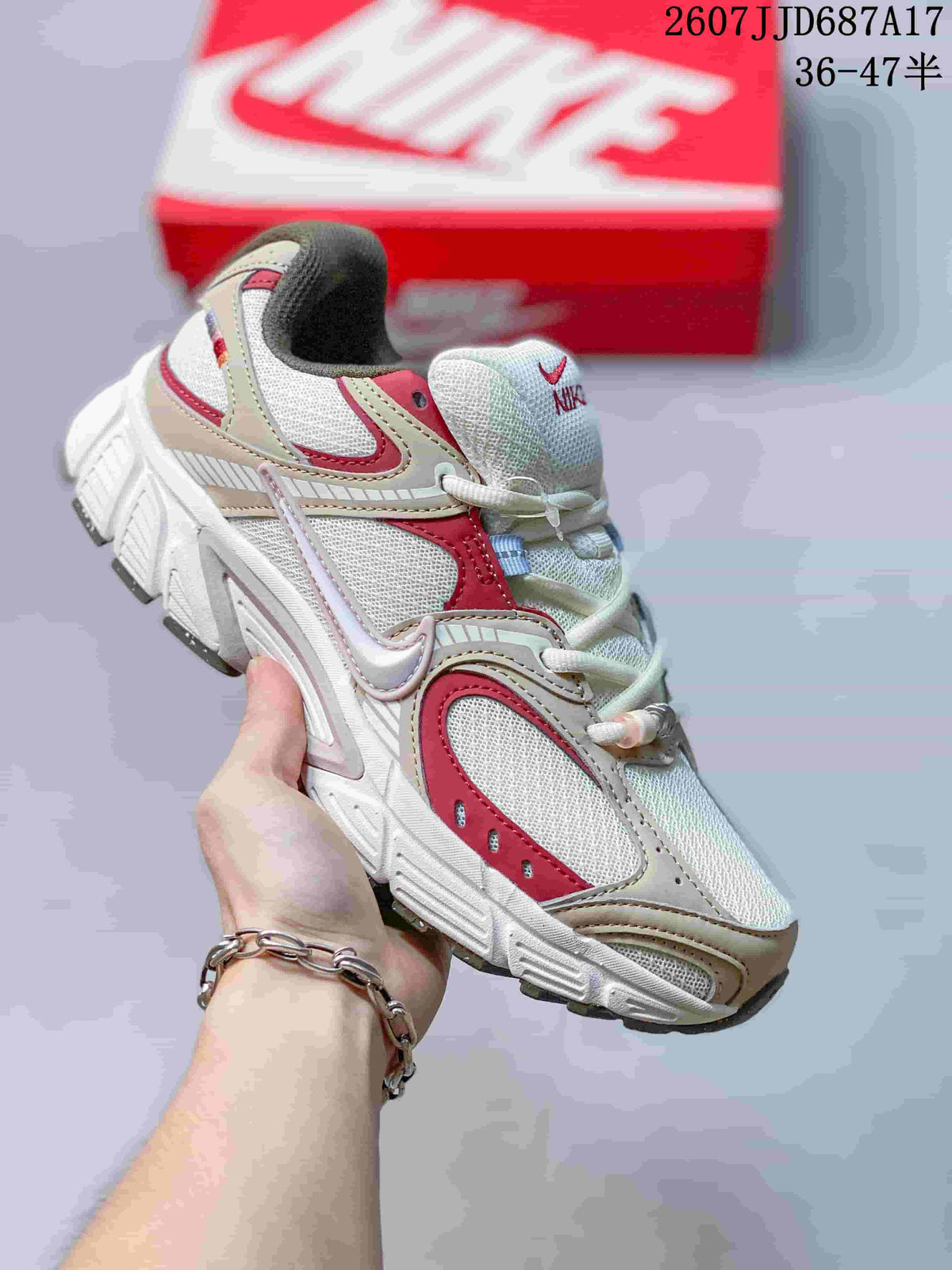 White Nike V5 RNR sneaker with red and beige accent panels.