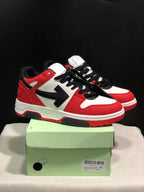 Pair of red, white, and black Off-White Out Of Office low-top sneakers displayed on a green shoe box.