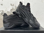 Pair of black Adidas sneakers displayed at an angle