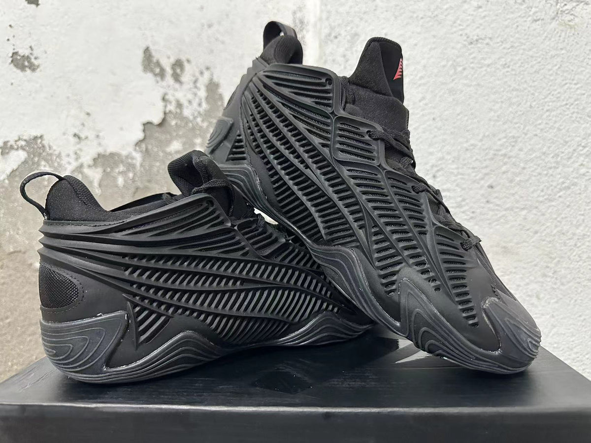 Pair of black Adidas sneakers displayed at an angle