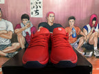 Front view of red Nike basketball shoes with matching laces and dark outsoles.