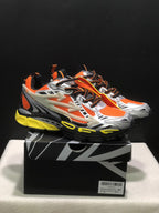 Pair of Off-White Be Right Back sneakers in orange, silver, black, and yellow displayed on a branded box.
