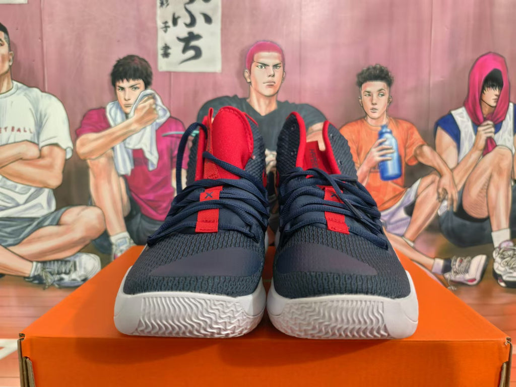 Front view of navy and red Nike basketball shoes with white soles