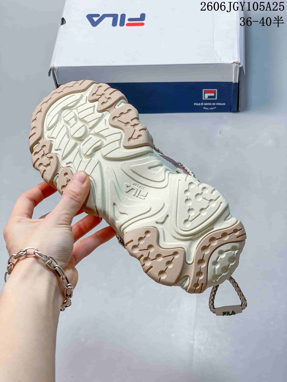 Textured outsole of a cream FILA Fusion sneaker
