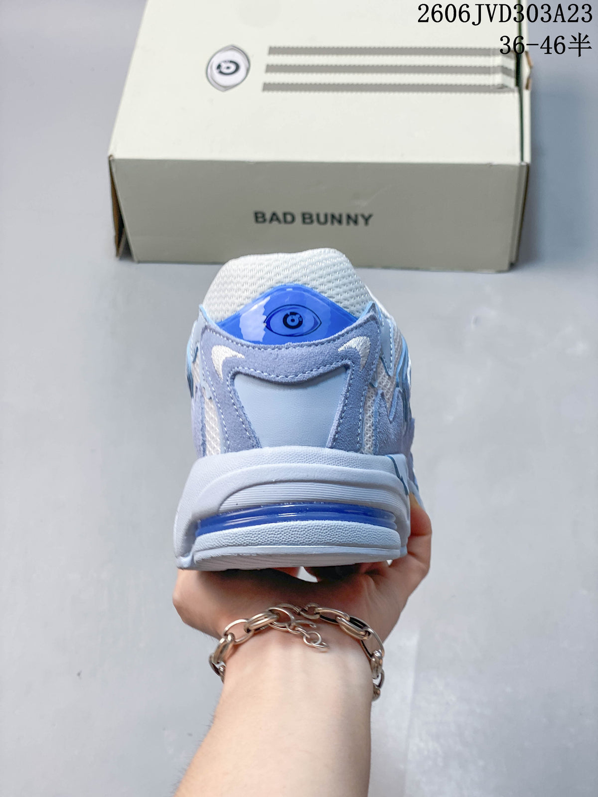 Rear view of the sneaker with a blue heel detail.