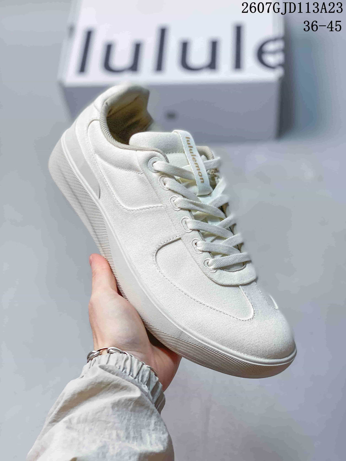 Side view of an off-white lululemon Cityverse sneaker showing the lace-up construction and white outsole; image text shows style code 2607GJD113A23 and size range 36–45.