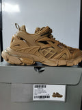 Camel Balenciaga Track.2 open sneaker shown in profile above its box, with the box label visible.