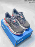 Pair of gray HOKA Bondi 9 shoes with white midsoles and red accents on a blue shoe box