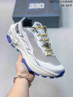 Angled side view of the Kailas Fuga Ex 330 shoe showing its grey upper, white midsole, yellow laces, and purple tread.