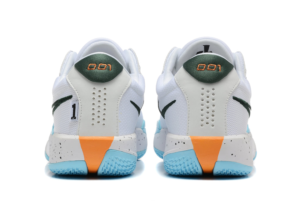 Rear view of the white basketball shoes showing green heel accents, perforated heel panels, and speckled midsoles.