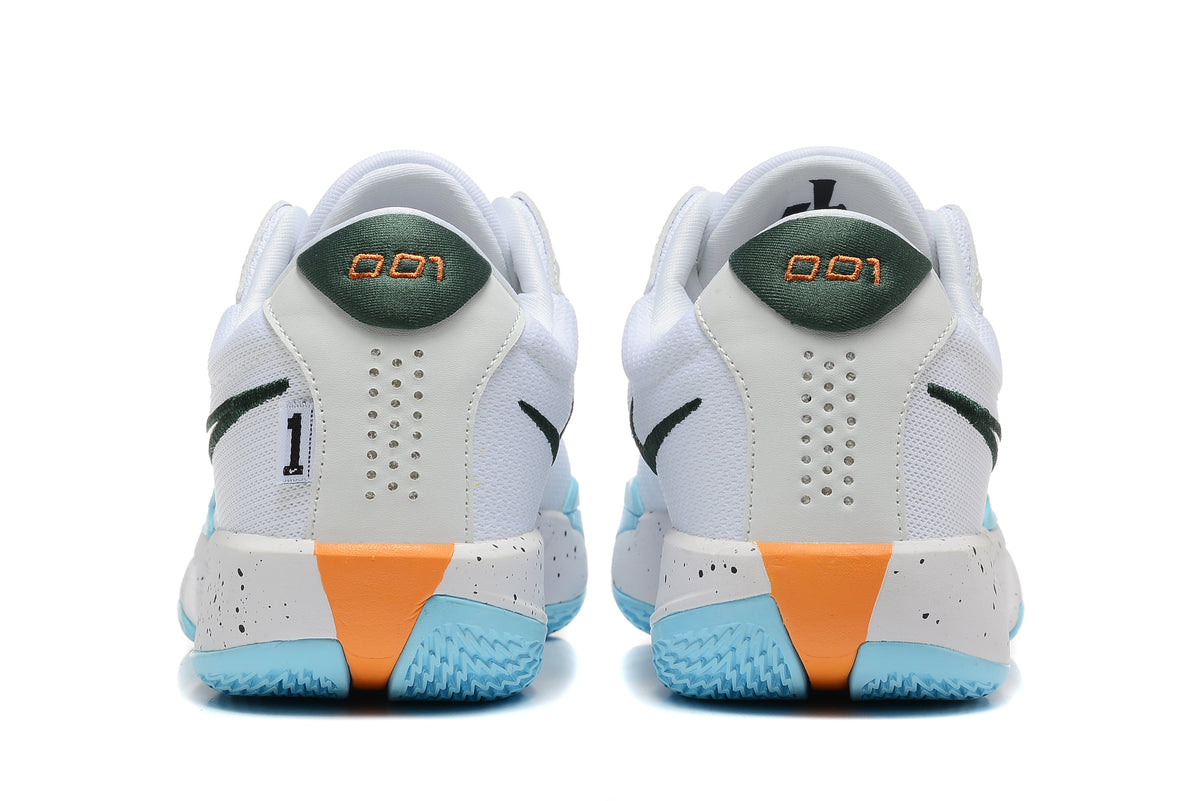 Rear view of the white basketball shoes showing green heel accents, perforated heel panels, and speckled midsoles.