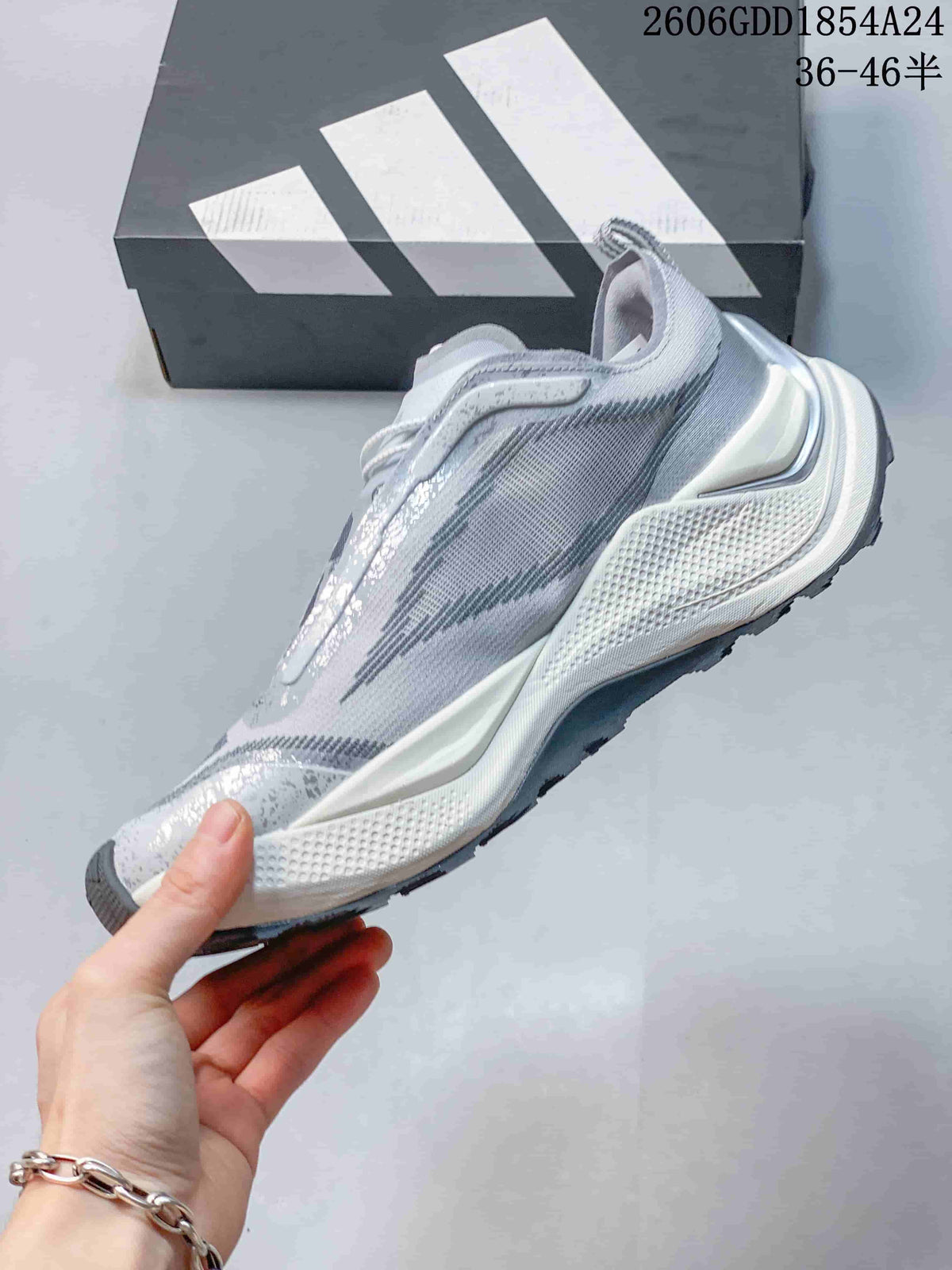Side view of an Adidas Holo Peak low-top trail running shoe in light gray and pale blue