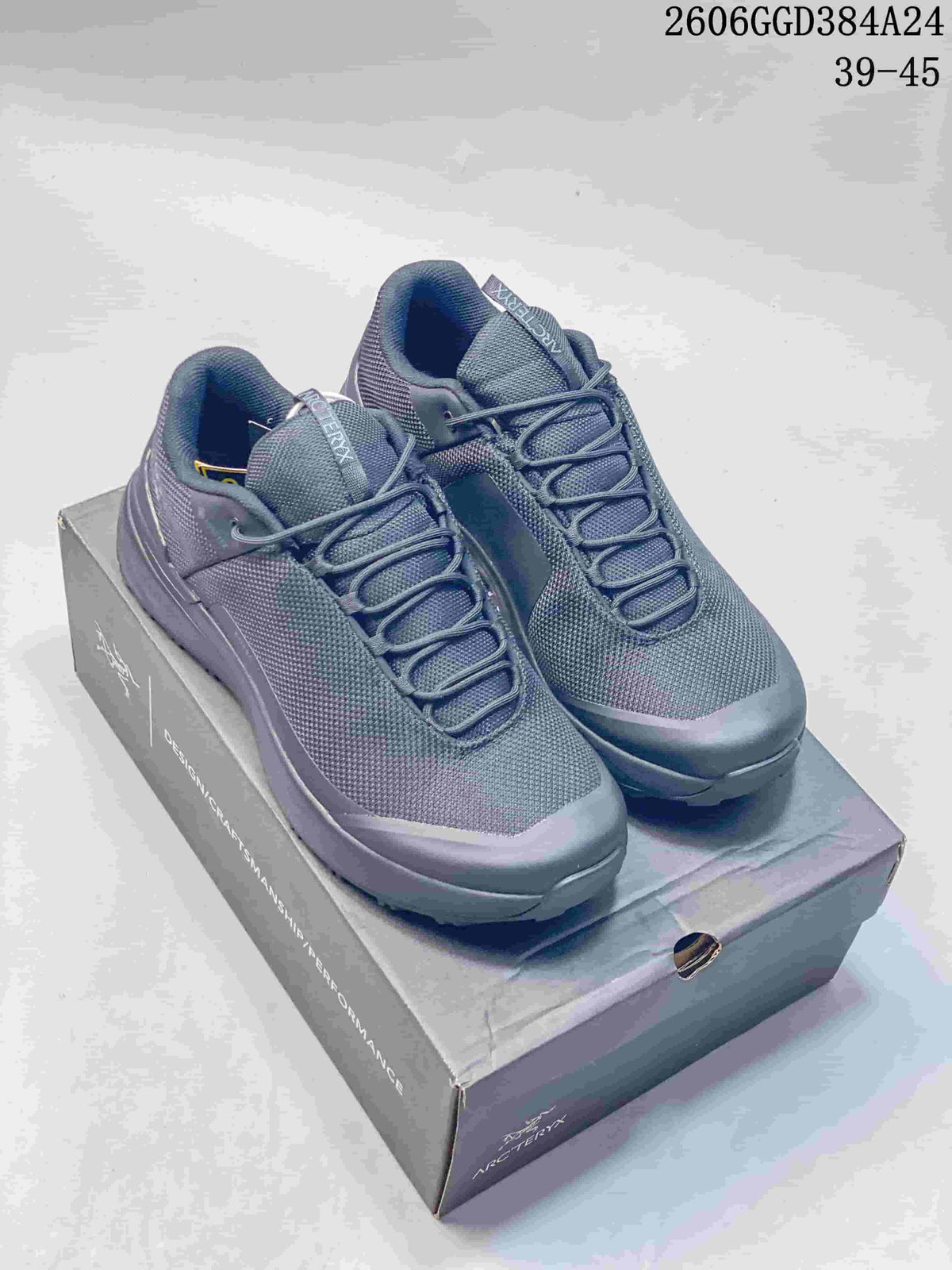 Pair of dark gray Arc'teryx-labeled low-cut hiking shoes on a box; image overlay shows sizes 39–45.