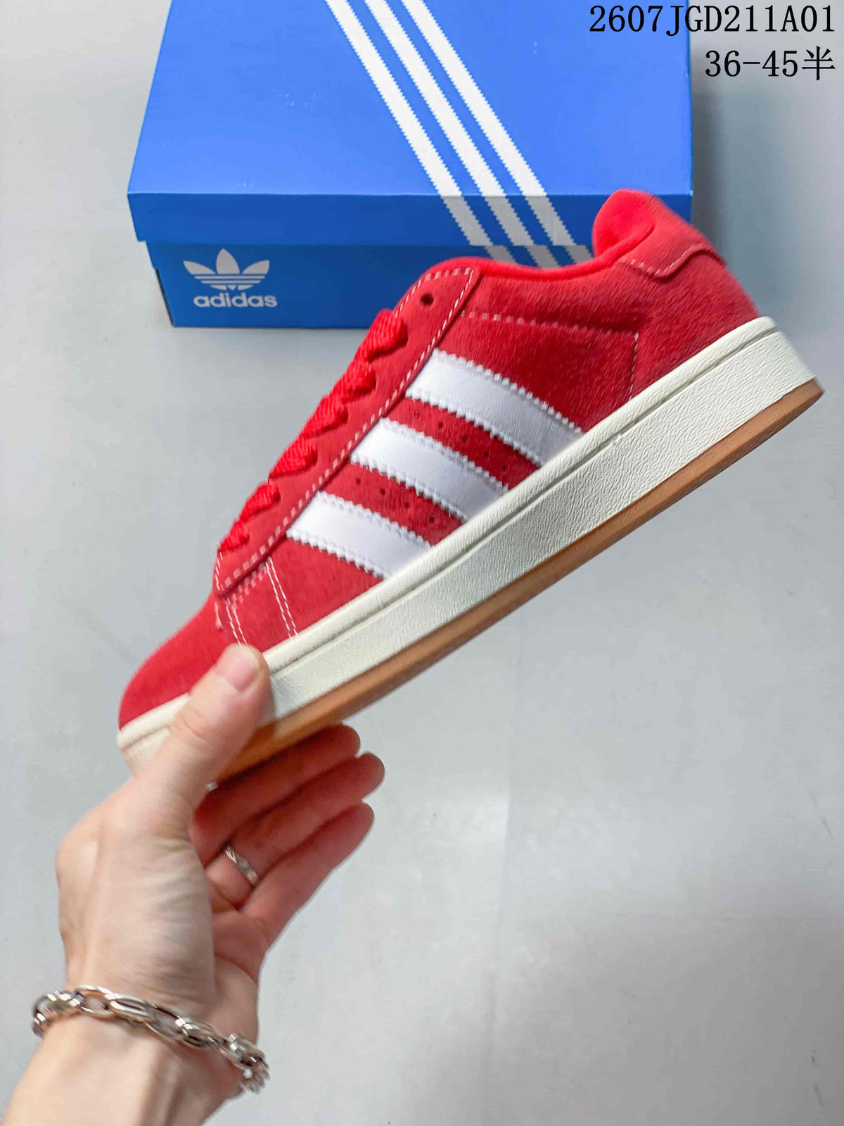Side profile showing red upper, white stripes, and gum outsole