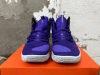 Front view of purple lace-up high-top basketball shoes with white soles
