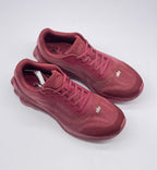 Top three-quarter view of the burgundy lace-up sneaker pair.