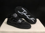 Black sneaker shown with the outsole facing upward, displaying the textured tread pattern and white graphics.