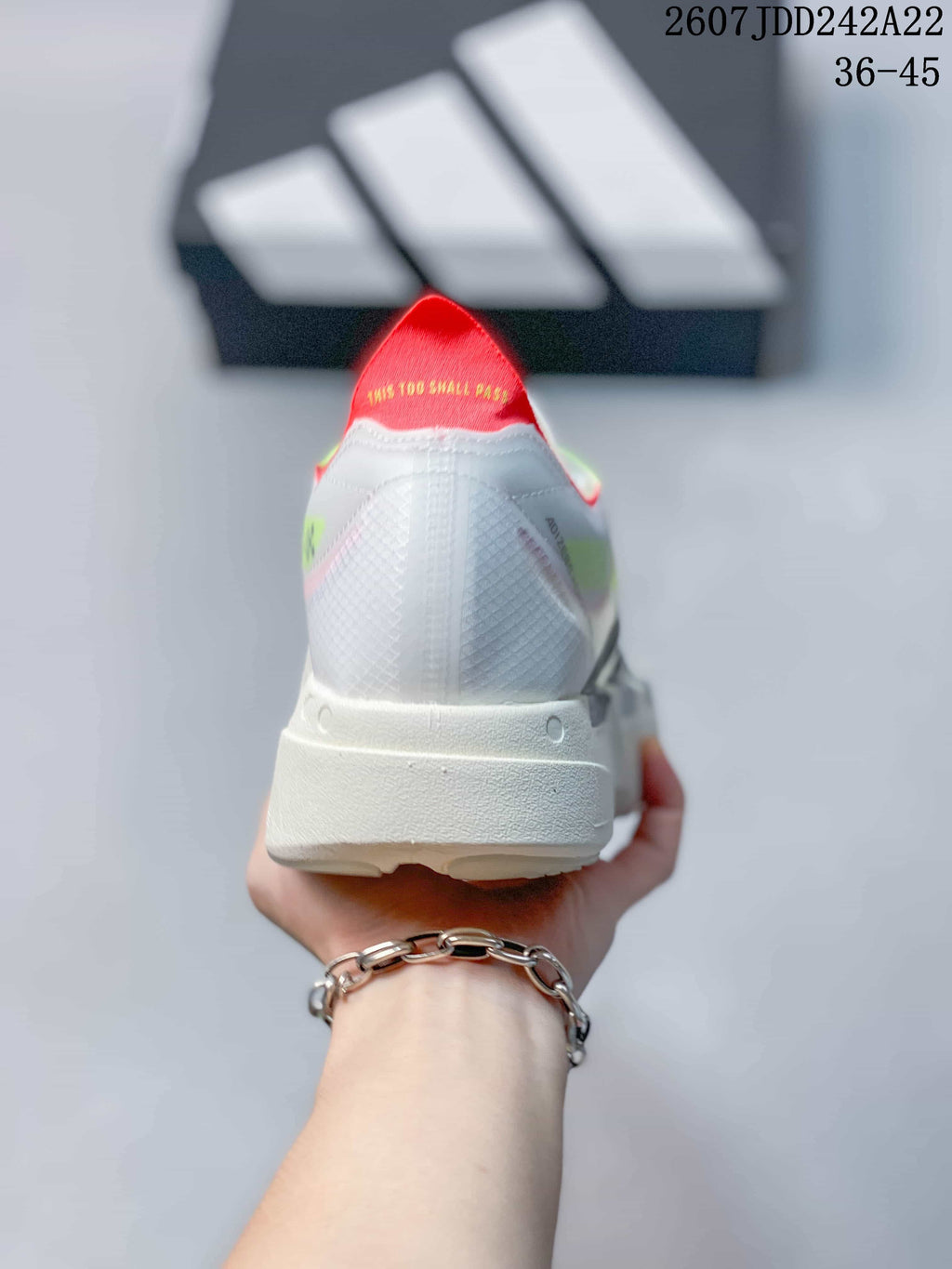 Rear view showing the white textured heel, raised white sole, and red padded collar.