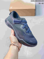 Side view of a dark blue On Cloudnova Moon sneaker showing its crossed laces and strap detail.