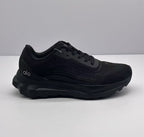 Side profile of an all-black Alo lace-up sneaker showing the layered upper, padded collar, and thick outsole.