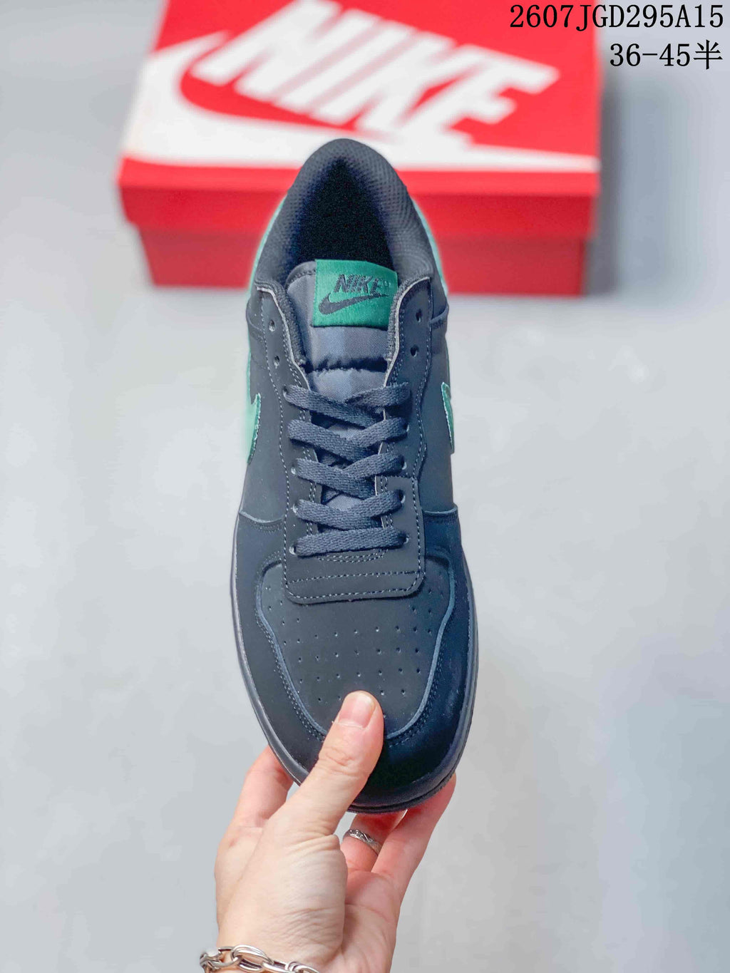 Top view of the sneaker showing the perforated toe box, dark laces, padded tongue, and mint-green tongue label.