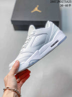 Side profile highlighting the white upper, perforated side panel and sculpted sole.