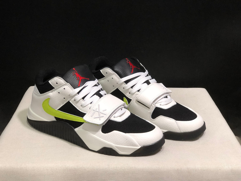 Three-quarter front view of the white and black sneakers with fluorescent green side accents.