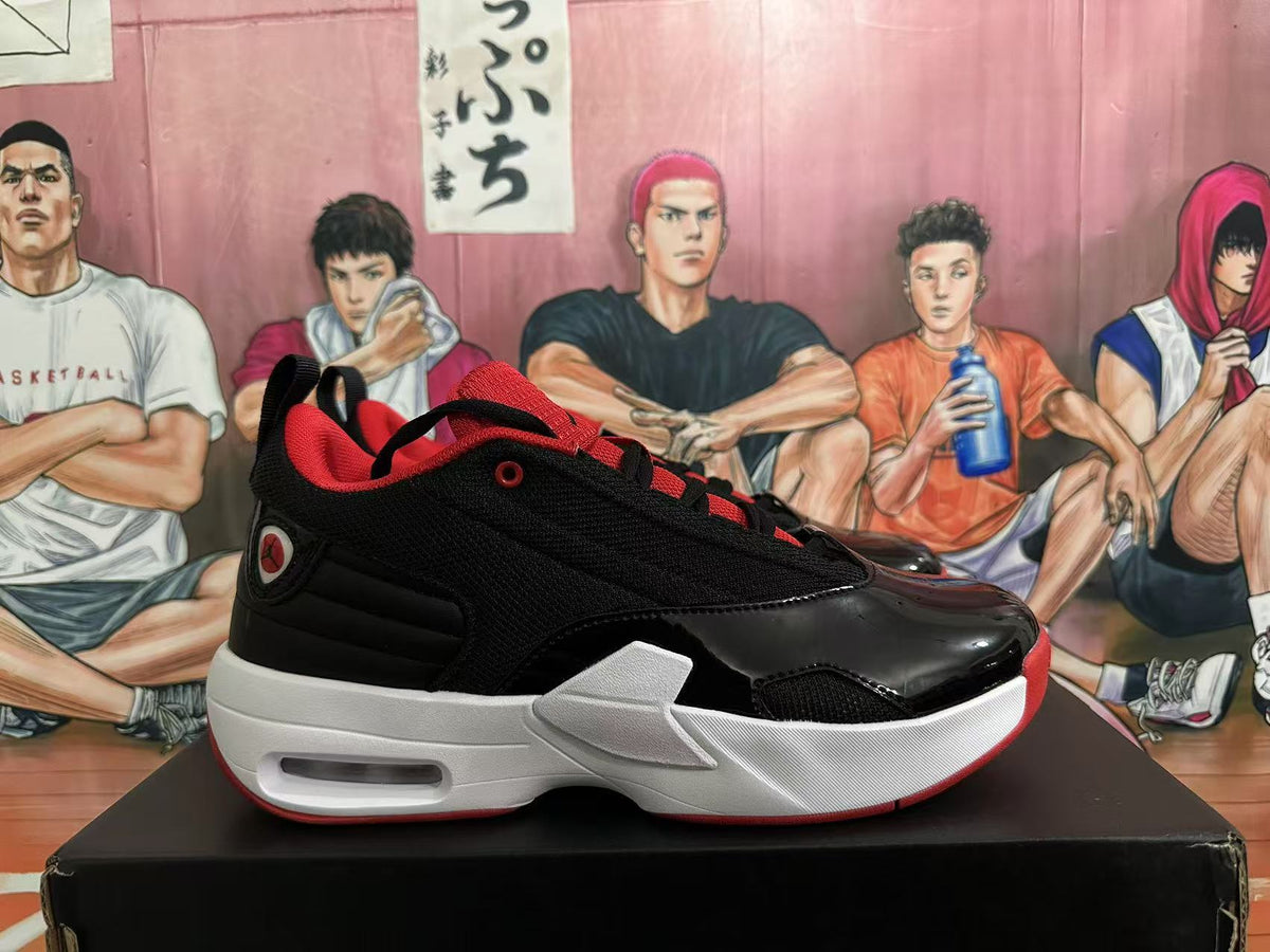 Side profile of a black sneaker with red details and a white midsole