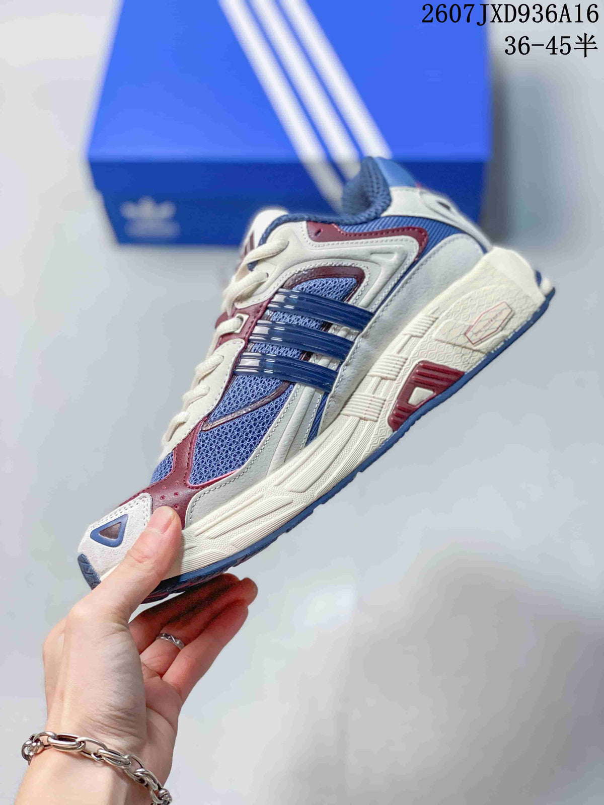 Side profile showing the layered upper, blue mesh panels, burgundy accents and sculpted cream midsole.