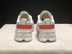 Rear view of the pair showing the coral heel stripe and On branding.