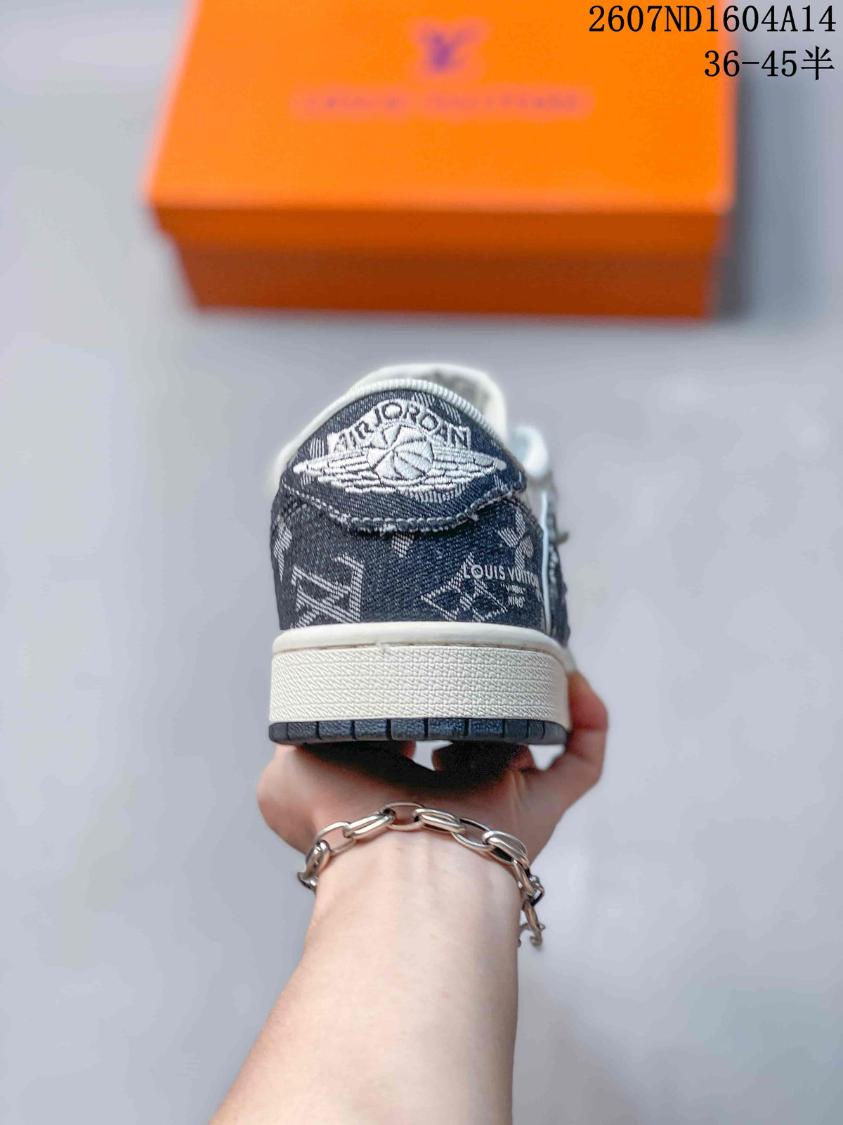 Rear view of the sneaker showing the patterned heel panel, white midsole, and dark outsole edge.