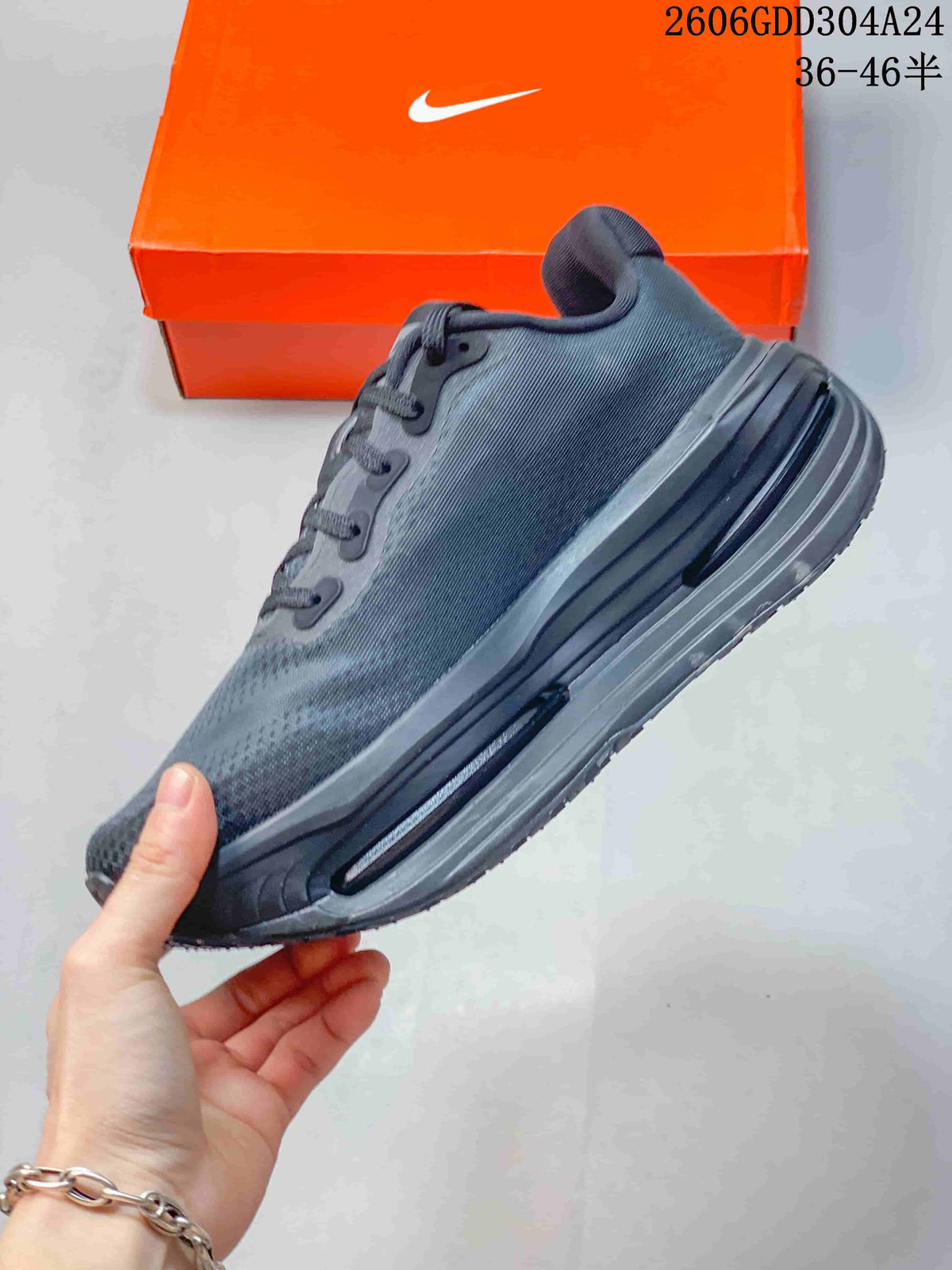 Side view of a black Nike Vomero Premium SP running shoe showing the midsole cushioning